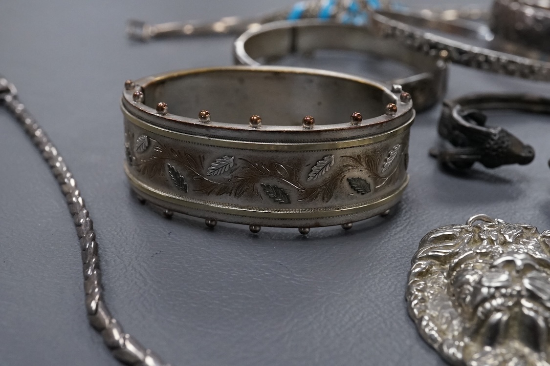 A group of assorted jewellery, including silver and white metal hinged bangles, a 1960's silver mounted cigar cutter by Ramsden & Roed, 925 necklaces and bracelet, etc.